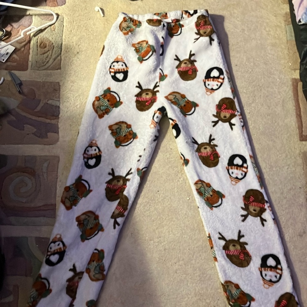 White Christmas pajama pants with Christmas animals on it